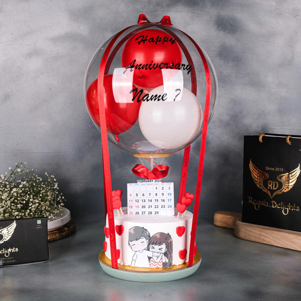 Red Balloon Anniversary Cake with Hearts and Custom Name Decoration